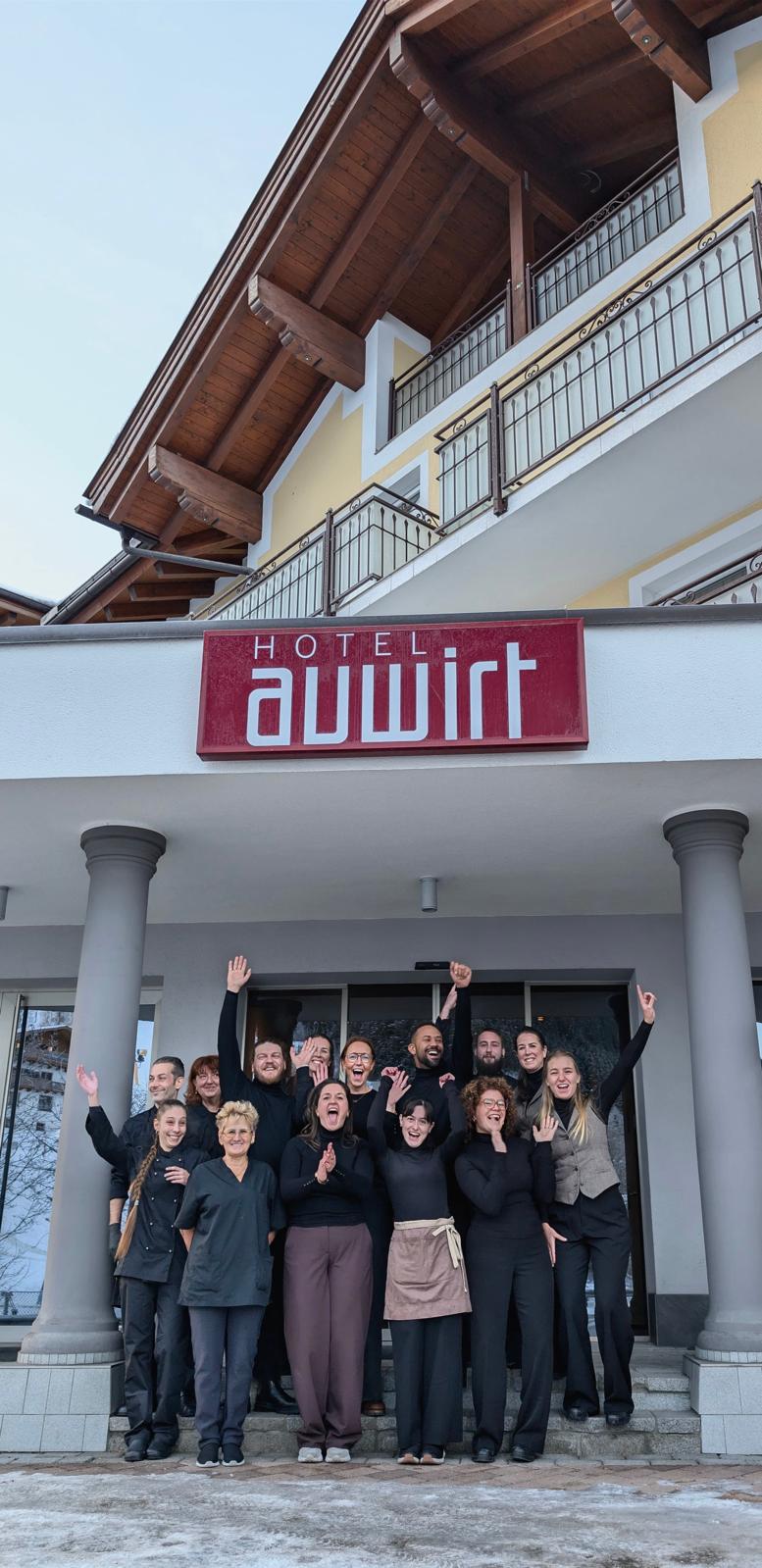Last year’s Wens Hotels team smiling and waving outside Hotel Auwirt
